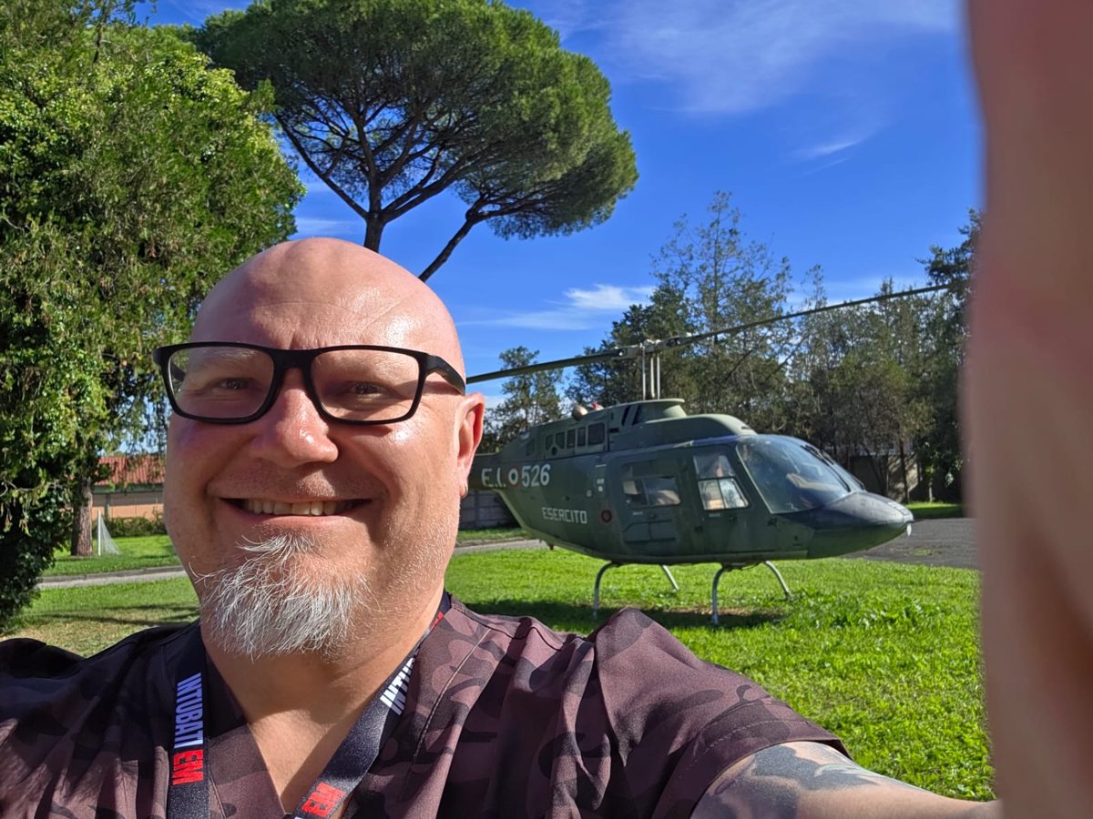 Dr Pieter Marais at the HITTER training venue in Rome beside an Italian Army helicopter