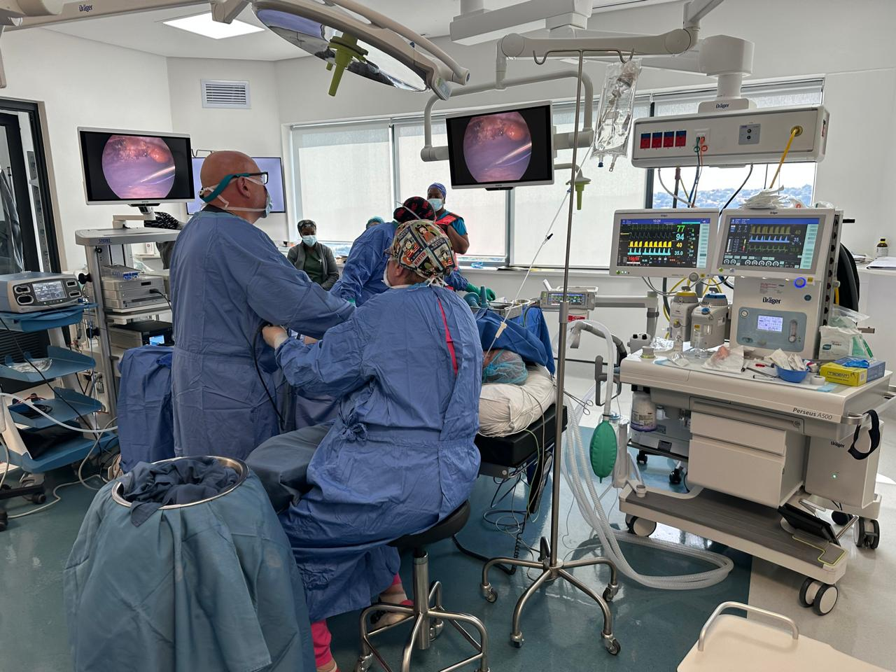 Operating theatre view with laparoscopic tower and endoscopic screens